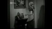 Děvče za výkladem [1937] avi